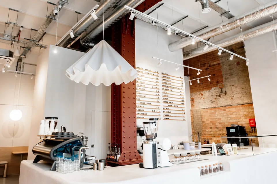 Espresso bar and menu board at 60 Degrees Coffee