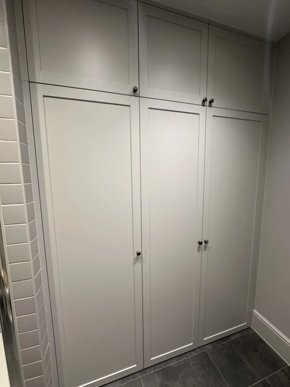 Painted built-in wardrobes on a landing