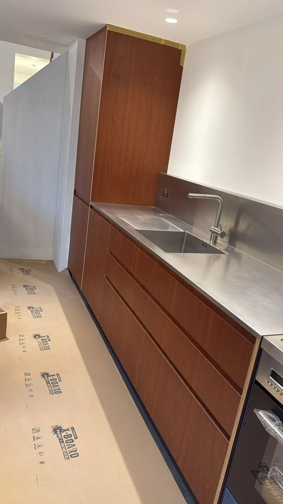 Walnut kitchen run with stainless steel worktop